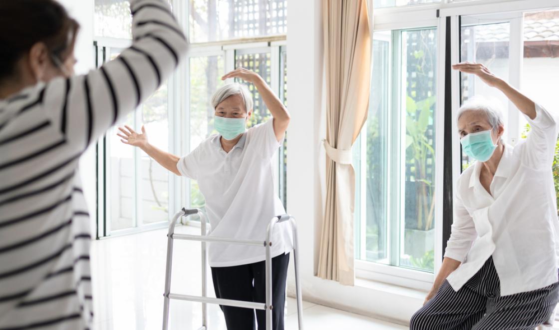 Elderly care home residents exercising