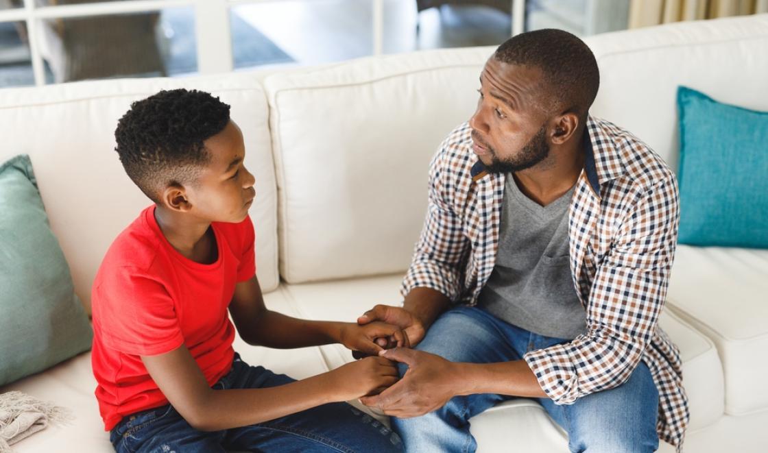 A father and son talking together