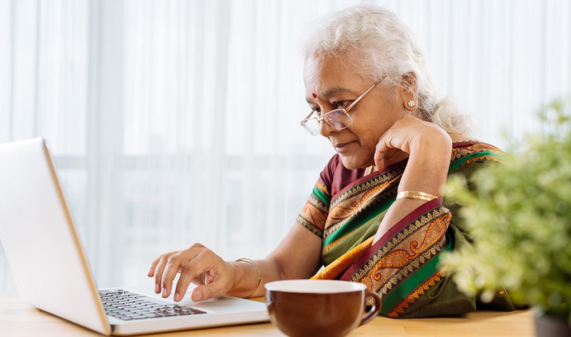 Older Asian woman on computer