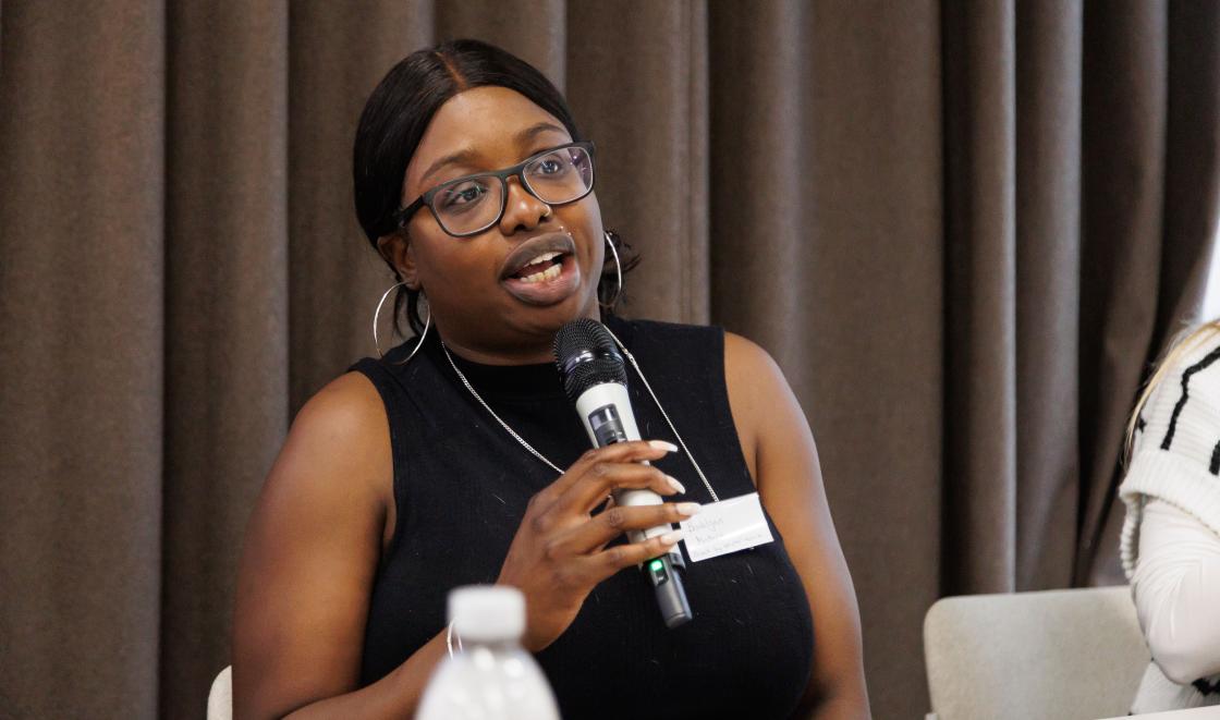 Brooklyn Masters speaking on a panel at the conference