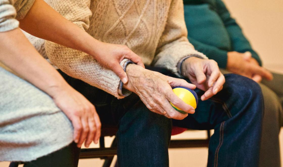 Image of an arm holding a ball