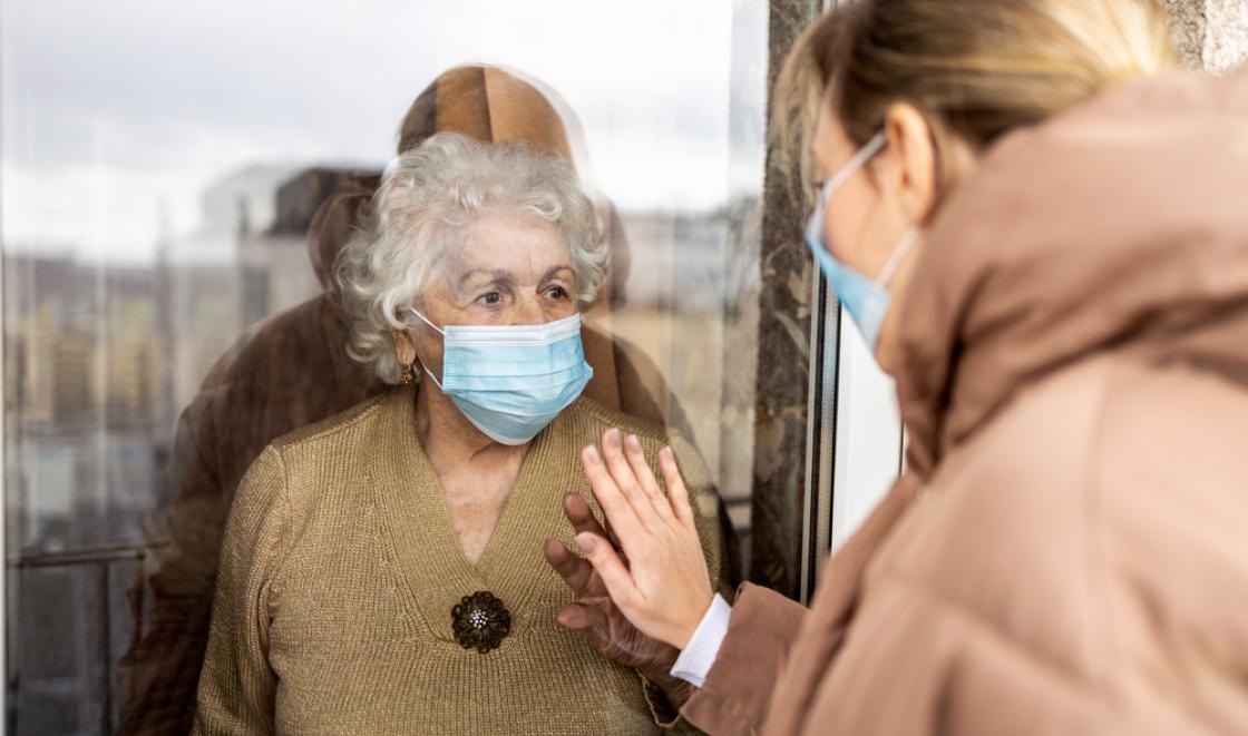 Woman visiting mother in care home during Covid-19 pandemic